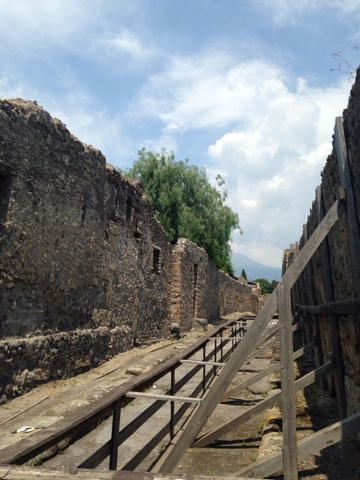 City streets and towering stone walls along the sides
